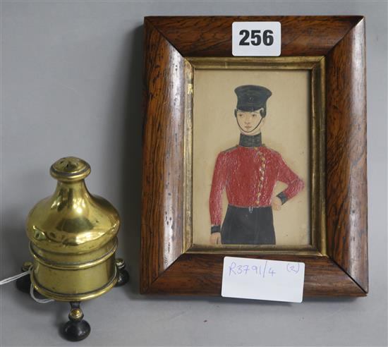 An early 19th century brass spice grinder and a naive watercolour of a soldier